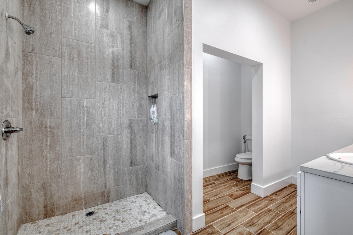 1601 County Road 466 Elgin, TX 78621 - Photo 18 of 39 a bathroom with a sink a toilet and shower