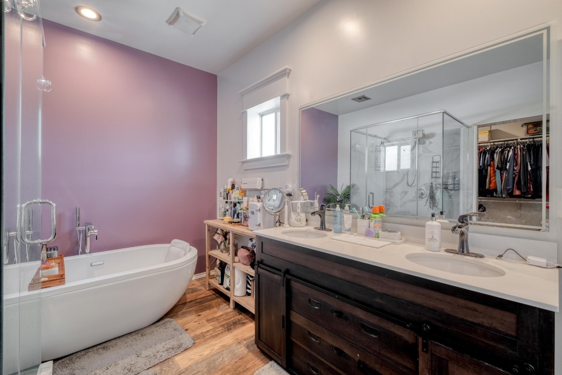 1601 County Road 466 Elgin, TX 78621 - Photo 20 of 39 a bathroom with a tub double sink and mirror