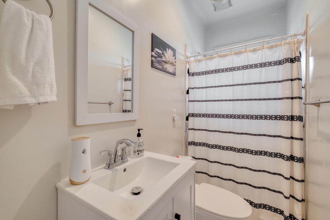 1601 County Road 466 Elgin, TX 78621 - Photo 24 of 39 a bathroom with a sink and a mirror