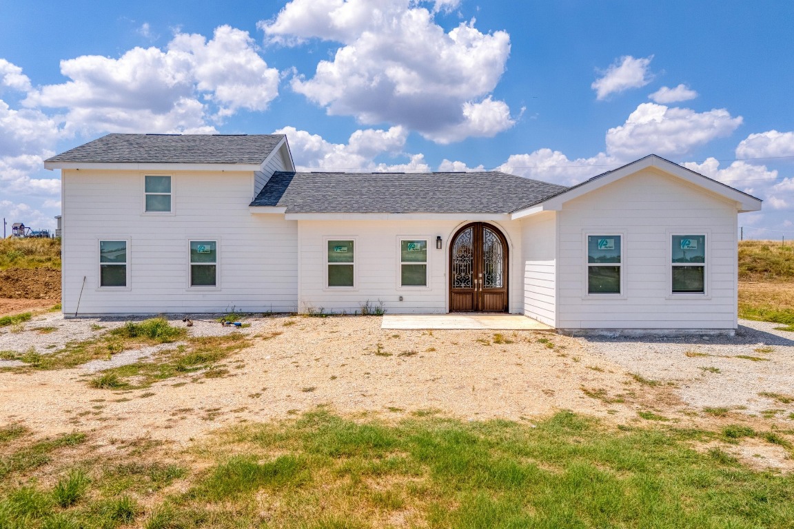1601 County Road 466 Elgin, TX 78621 - Photo 26 of 39 a front view of a house with a yard