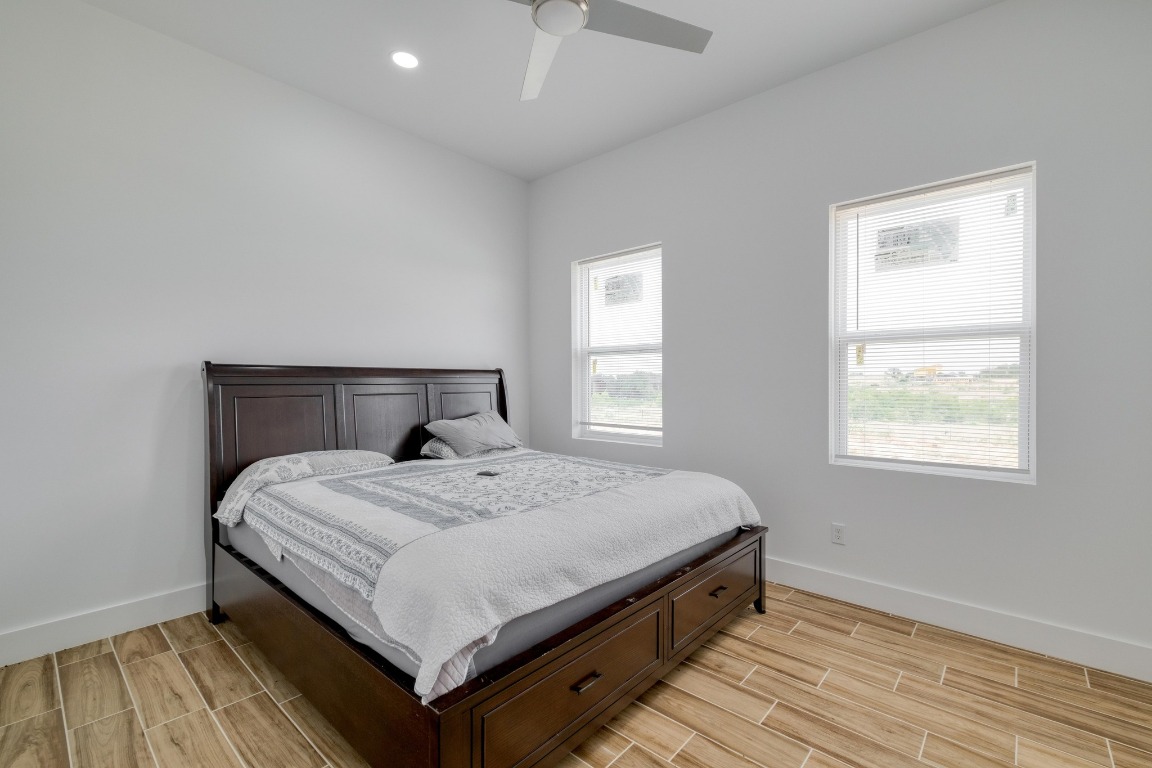 1601 County Road 466 Elgin, TX 78621 - Photo 30 of 39 a bed sitting in a bedroom next to a window