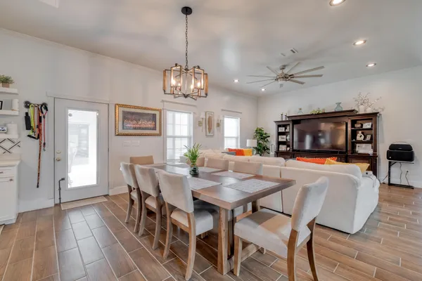 a view of a dining room with furniture window and wooden floor