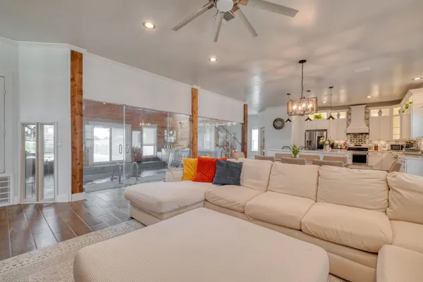 a living room with furniture and a chandelier