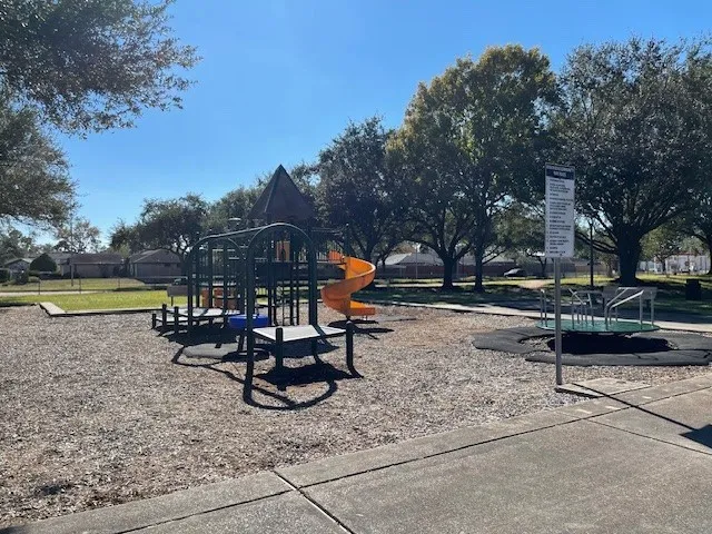 a view of a park with sitting area