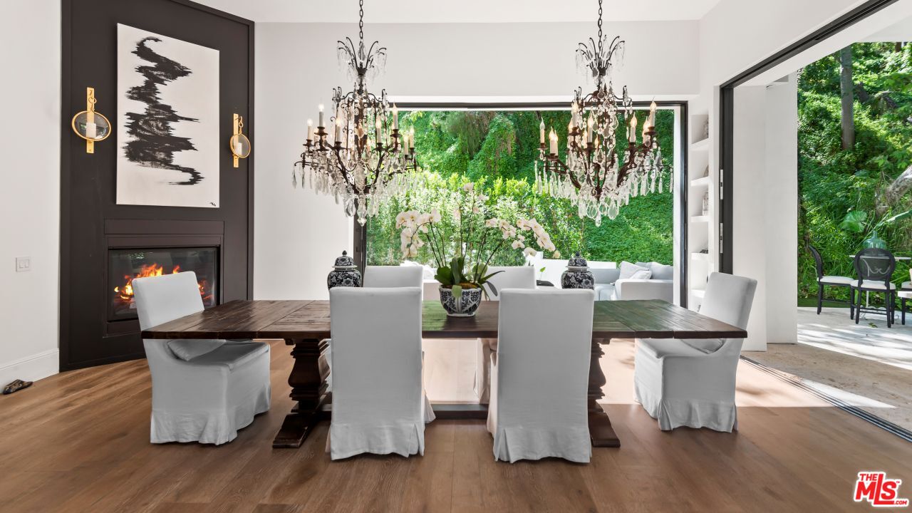 2231 Benedict Canyon Drive Beverly Hills, CA 90210 - Photo 13 of 50 a view of a dining room with furniture window and wooden floor