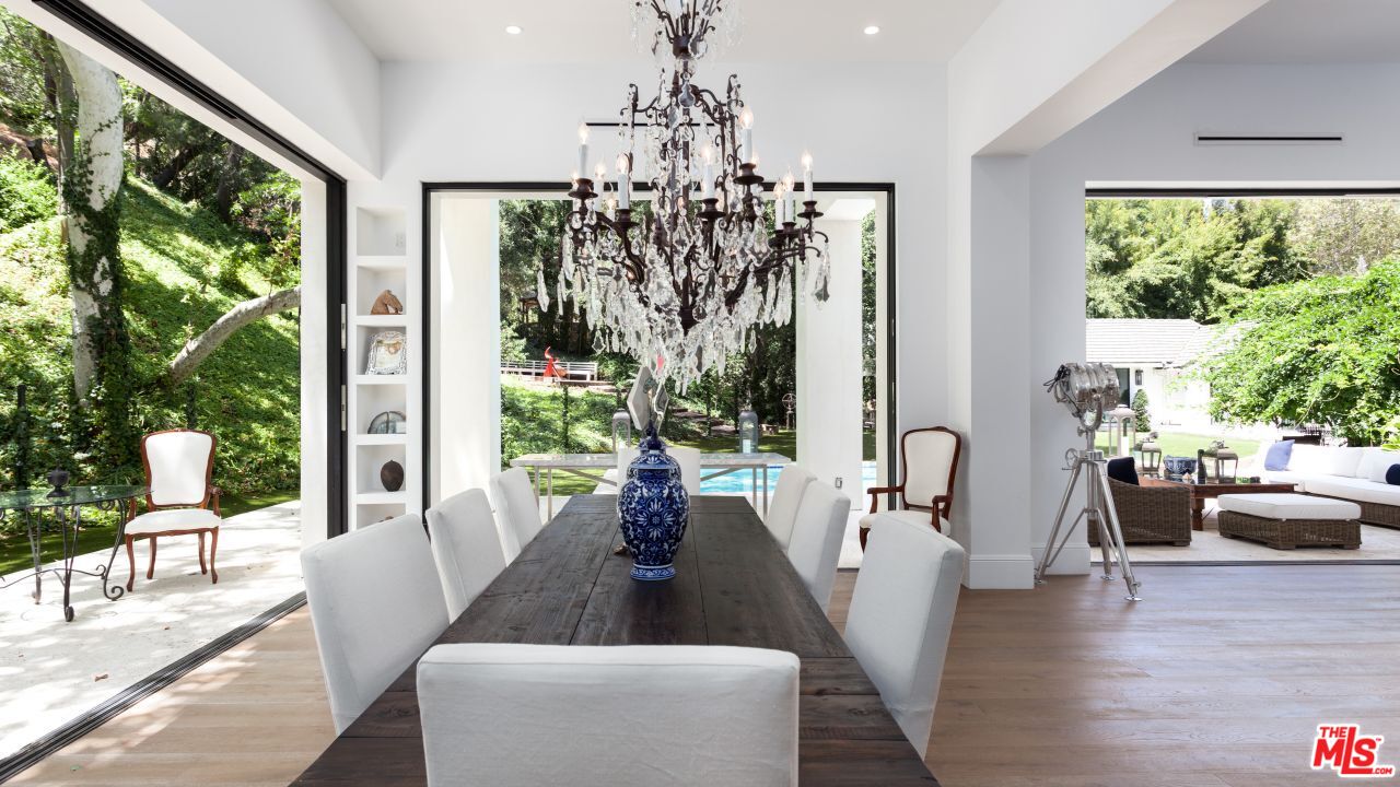 2231 Benedict Canyon Drive Beverly Hills, CA 90210 - Photo 14 of 50 a living room with furniture and a large window