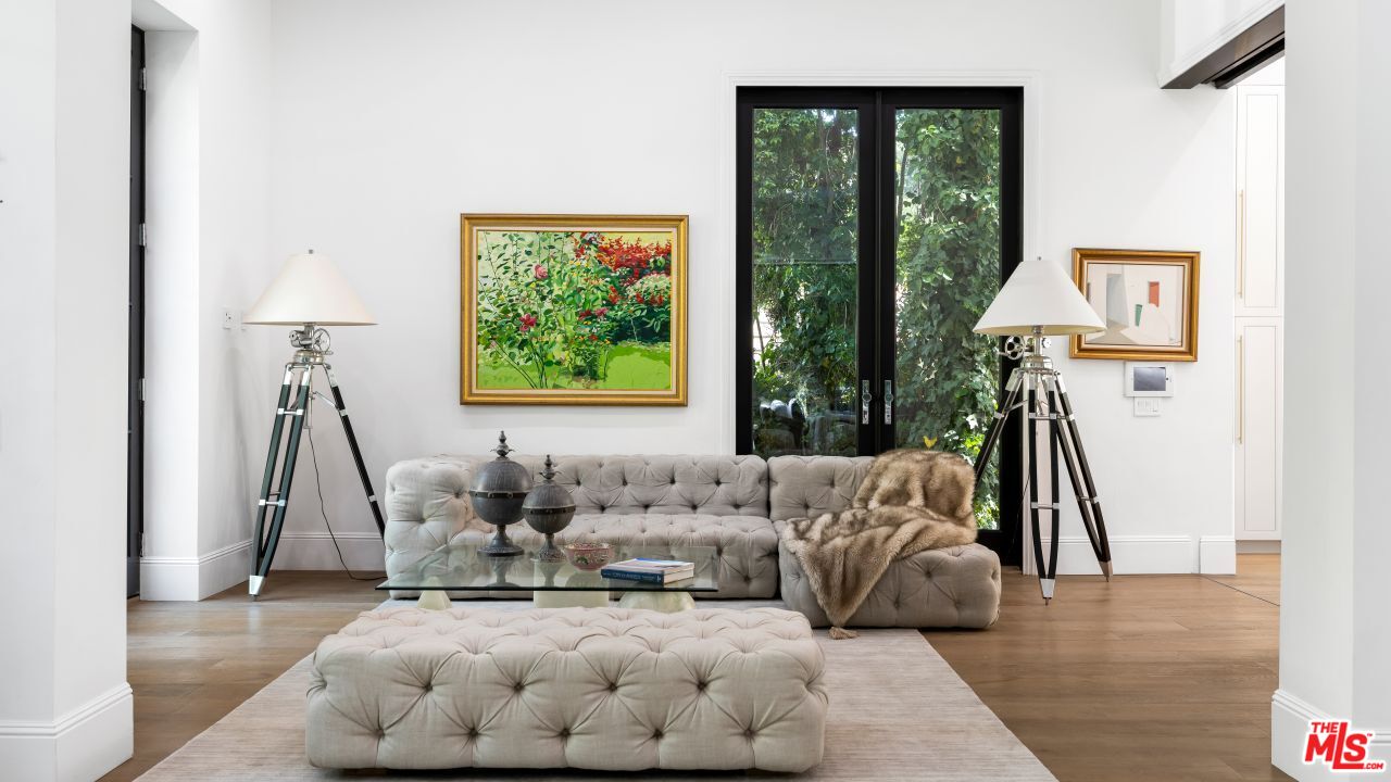 2231 Benedict Canyon Drive Beverly Hills, CA 90210 - Photo 19 of 50 a living room with furniture and a large window