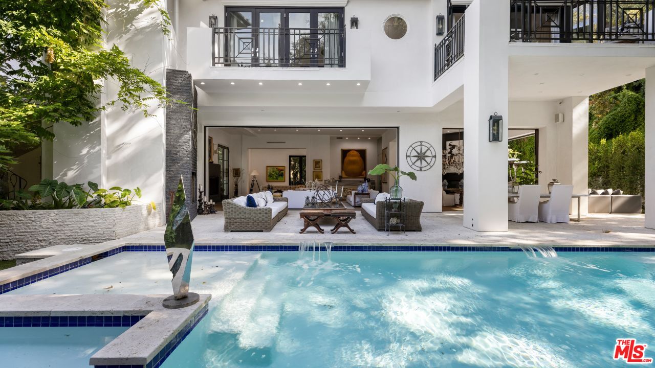 2231 Benedict Canyon Drive Beverly Hills, CA 90210 - Photo 21 of 50 a view of a house with backyard porch and patio