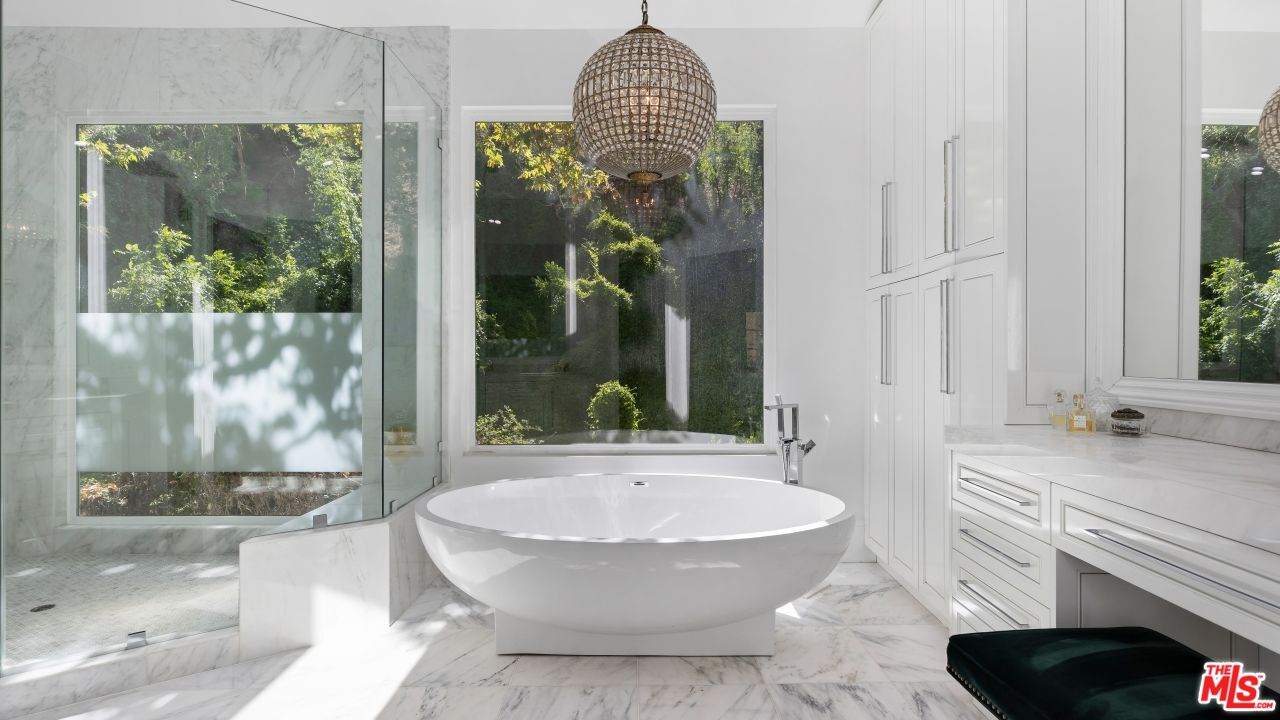 2231 Benedict Canyon Drive Beverly Hills, CA 90210 - Photo 29 of 50 a bathroom with a granite countertop sink and a mirror