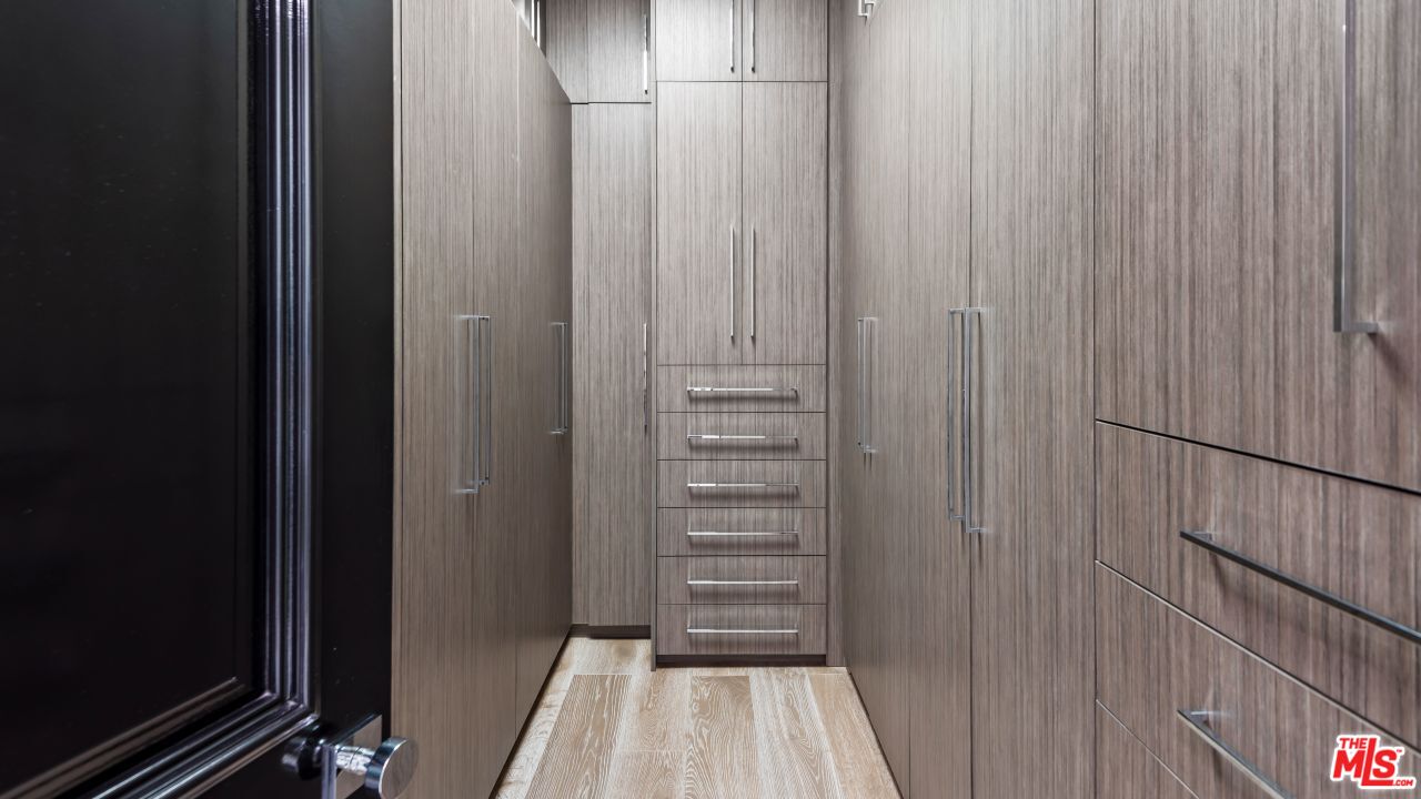 2231 Benedict Canyon Drive Beverly Hills, CA 90210 - Photo 33 of 50 a view of a hallway with wooden floor