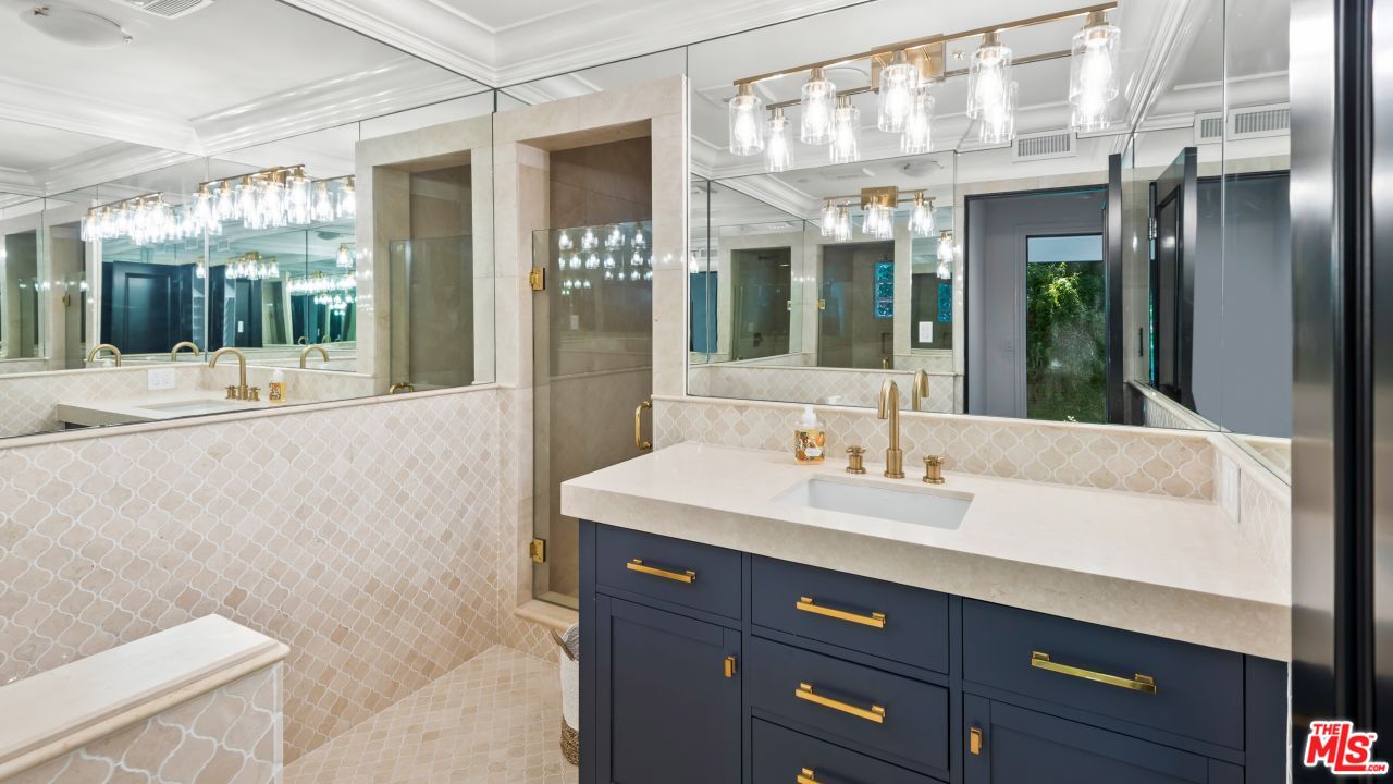 2231 Benedict Canyon Drive Beverly Hills, CA 90210 - Photo 38 of 50 a bathroom with a sink a toilet and shower