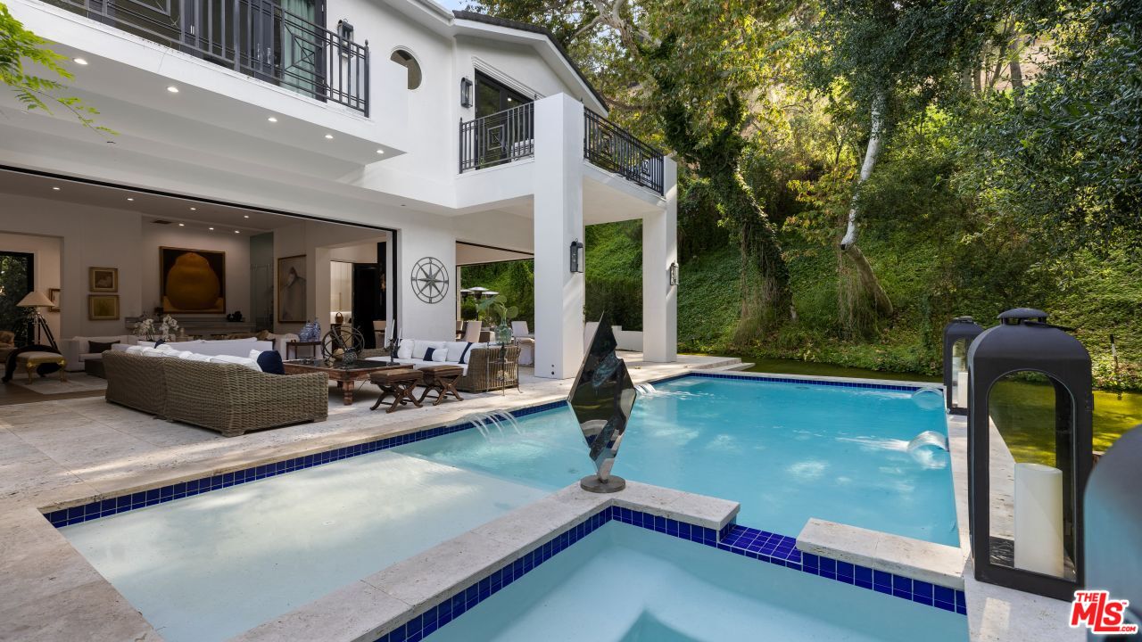 2231 Benedict Canyon Drive Beverly Hills, CA 90210 - Photo 39 of 50 a view of a patio with swimming pool table and chairs