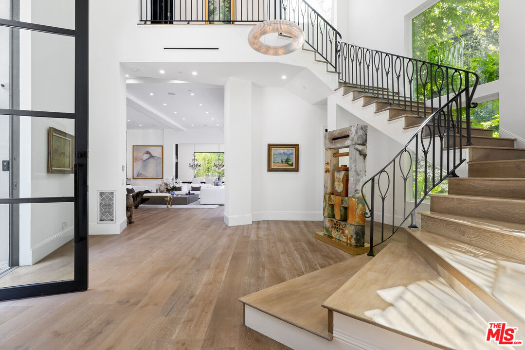 2231 Benedict Canyon Drive Beverly Hills, CA 90210 - Photo 47 of 50 a view of front door with wooden floor and a rug