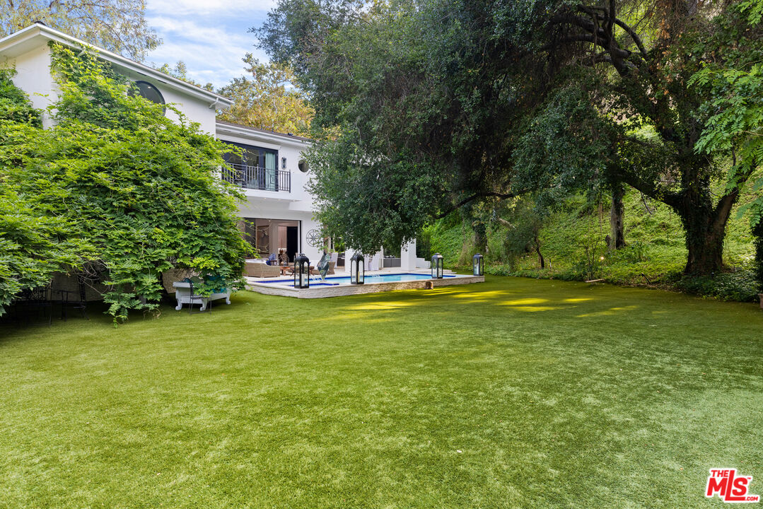 2231 Benedict Canyon Drive Beverly Hills, CA 90210 - Photo 48 of 50 a view of outdoor space with garden and trees
