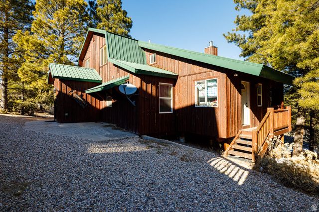 1505 West Elk Ridge Drive Alton, UT 84710 - Photo 5 of 53 View of front of property featuring a gambrel roof, a metal roof, and a chimney