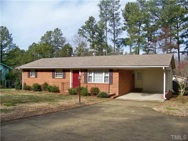 436 Sherron Road Durham, NC 27703 - Photo 1 of 19 a front view of a house with a yard and garage