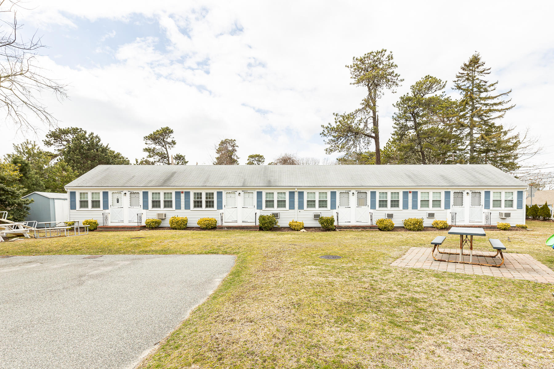 49 Lower County Road Dennis, MA 02639 - Photo 3 of 19 a front view of a house with swimming pool and view of a house