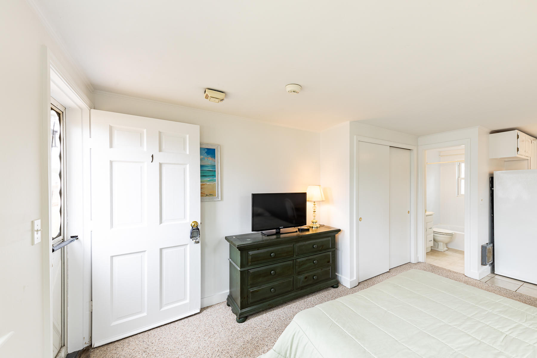 49 Lower County Road Dennis, MA 02639 - Photo 7 of 19 a bedroom with a bed and a flat screen tv