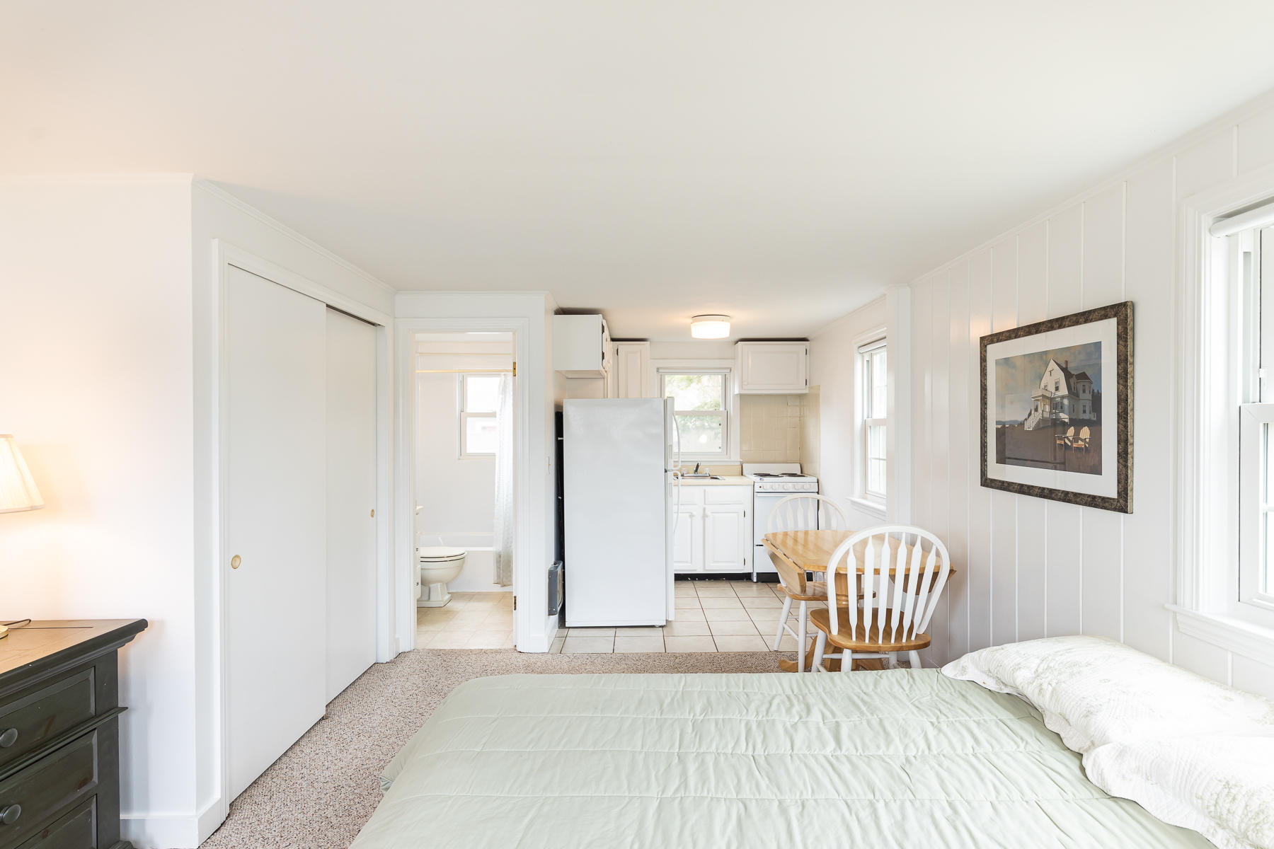 49 Lower County Road Dennis, MA 02639 - Photo 8 of 19 a bedroom with a bed and a couch