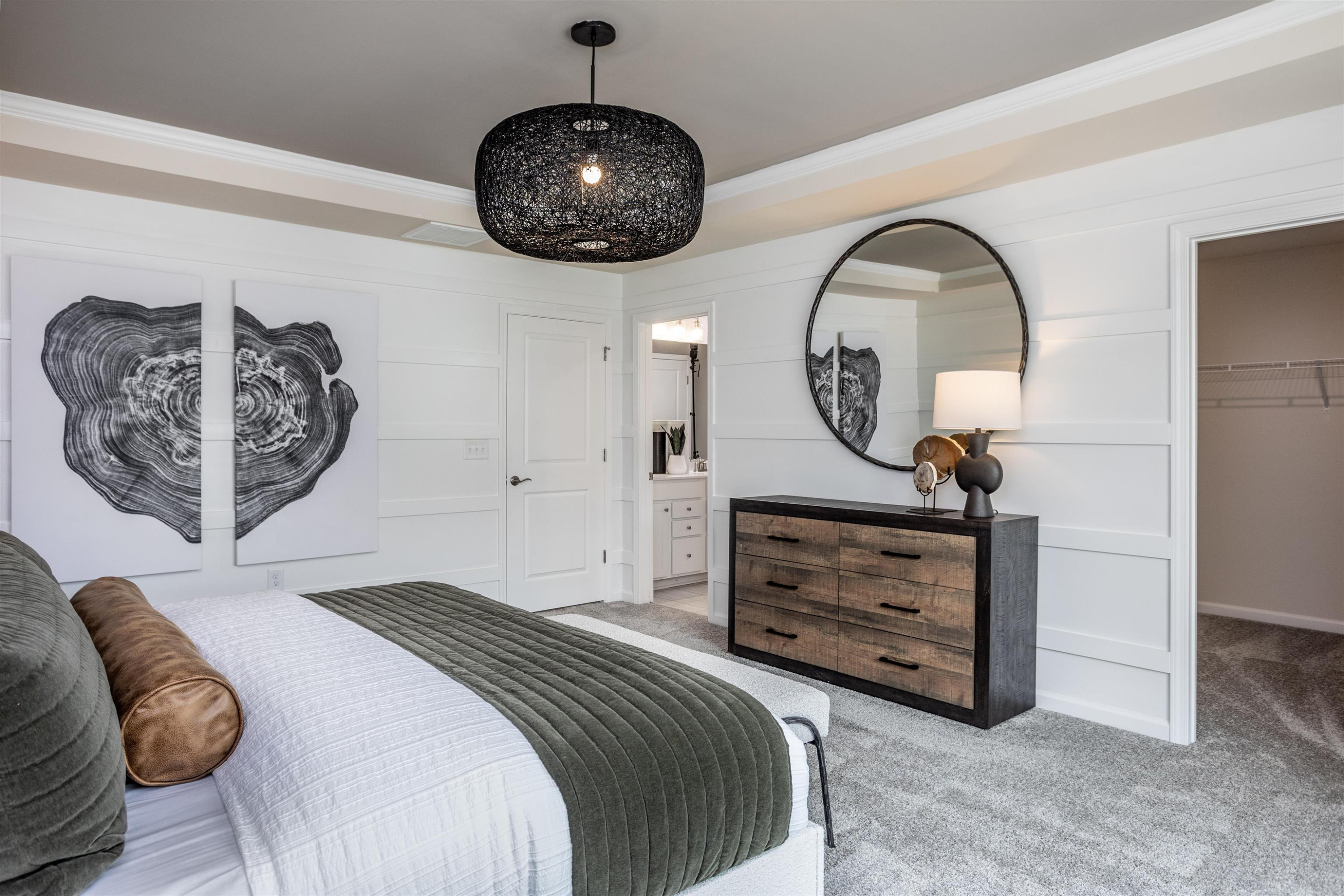 320 Abbots Ml Drive Raleigh, NC 27603 - Photo 13 of 17 a bedroom with a bed and a chandelier