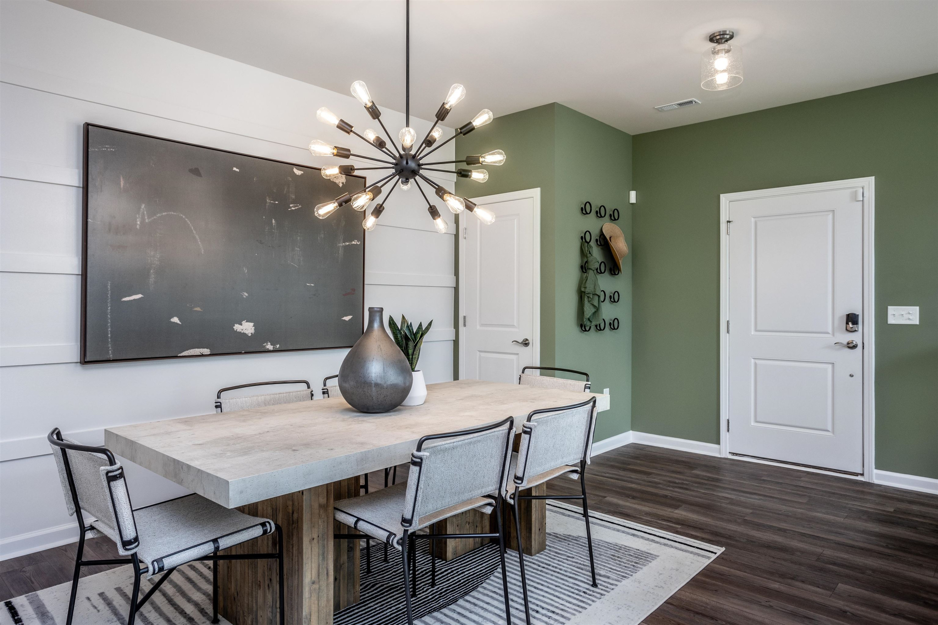 320 Abbots Ml Drive Raleigh, NC 27603 - Photo 10 of 17 a view of a dining room with furniture wooden floor and chandelier