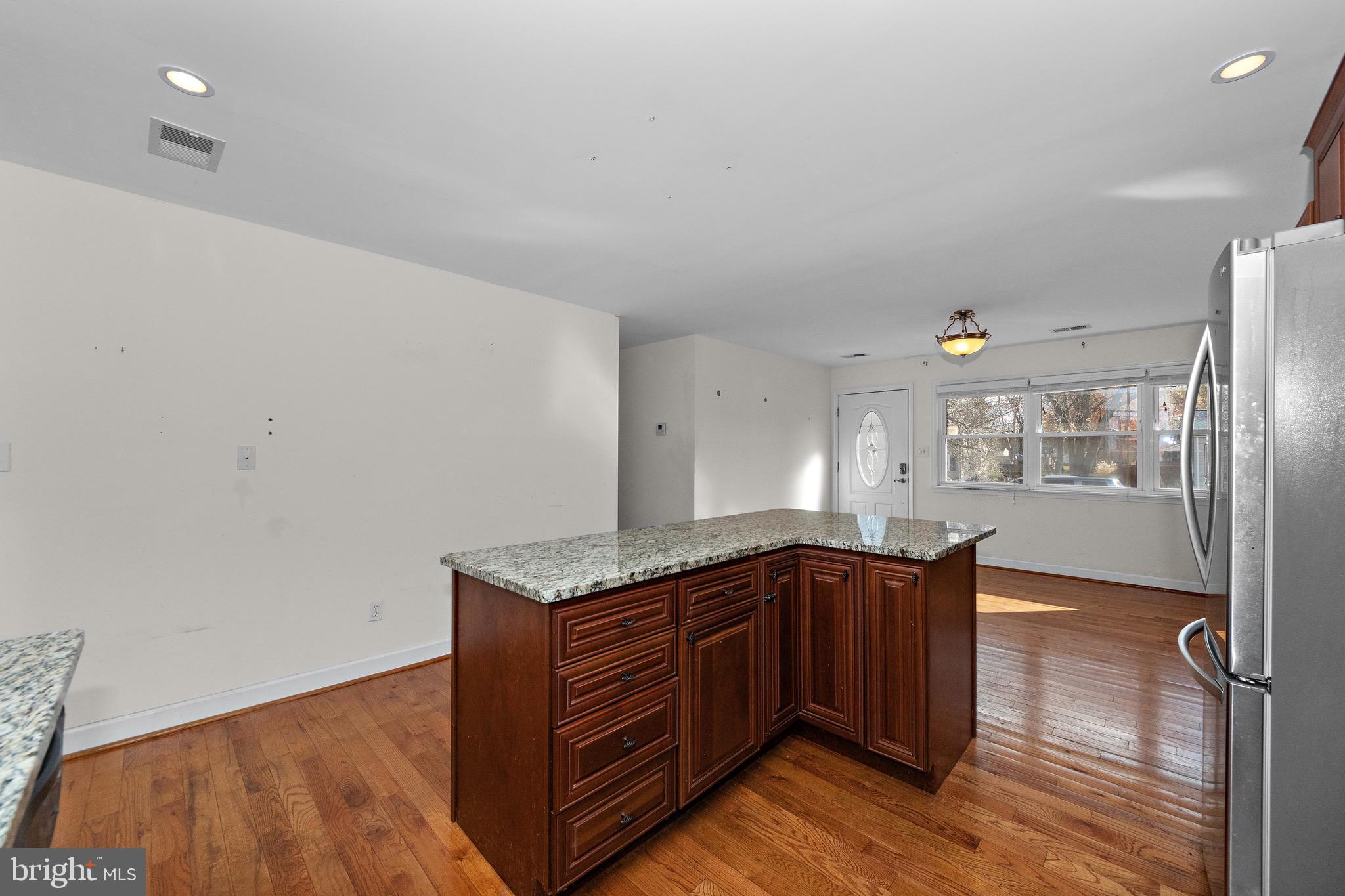 115 Valley View Avenue Edgewater, MD 21037 - Photo 13 of 56 a kitchen with stainless steel appliances granite countertop a sink and wooden cabinets