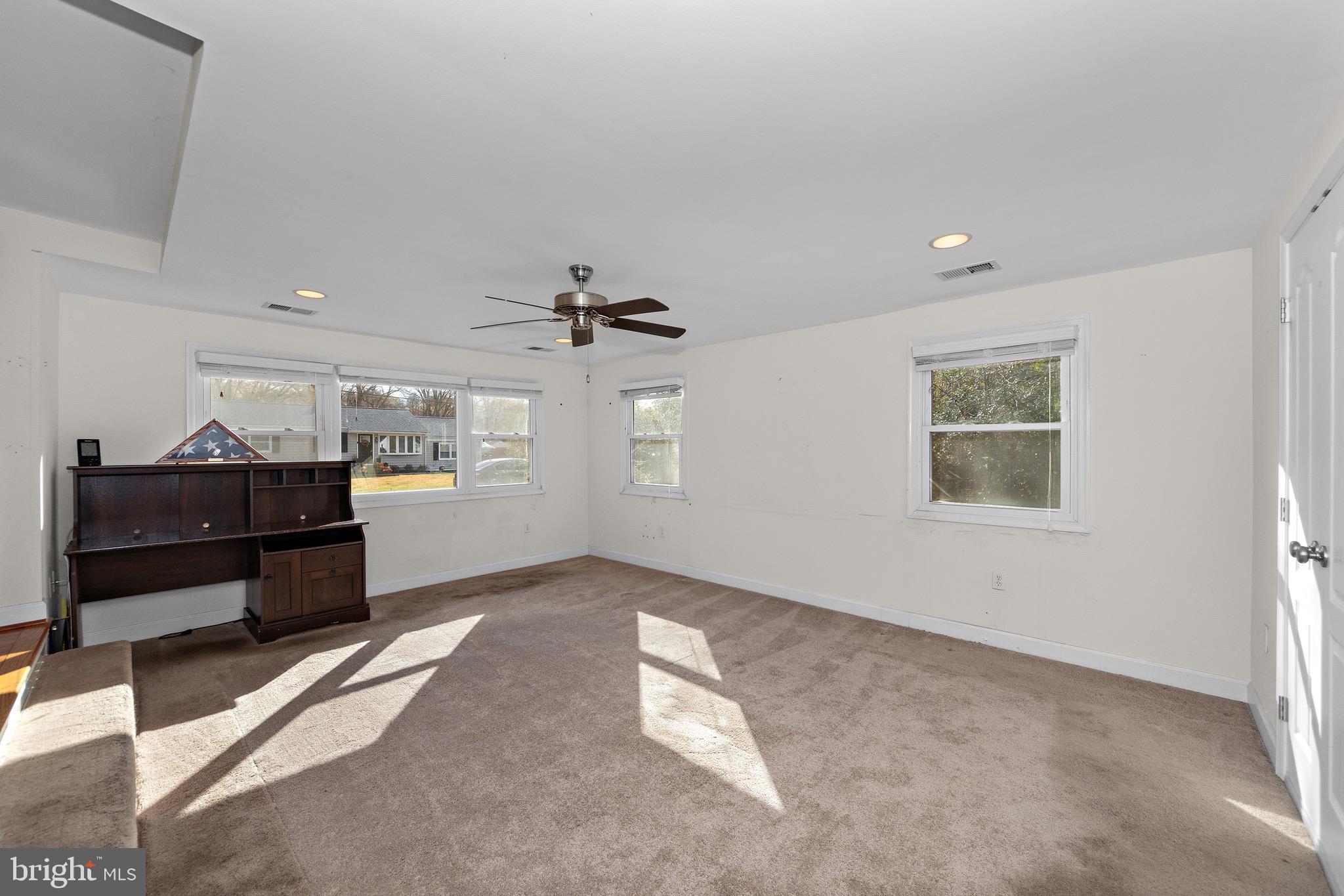 115 Valley View Avenue Edgewater, MD 21037 - Photo 15 of 56 a view of workspace with wooden floor and ceiling fan