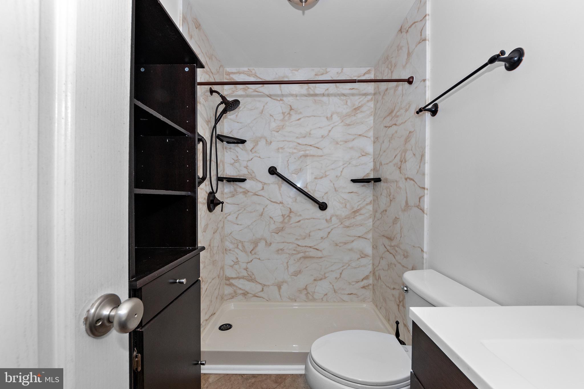 115 Valley View Avenue Edgewater, MD 21037 - Photo 26 of 56 a white toilet sitting next to a bath tub