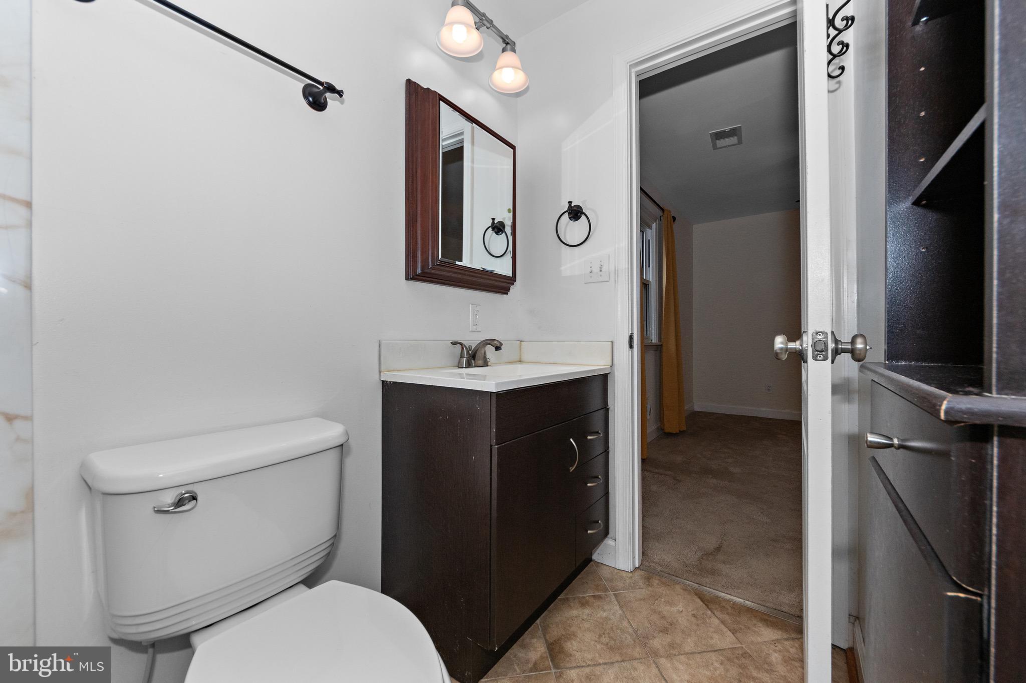 115 Valley View Avenue Edgewater, MD 21037 - Photo 28 of 56 a bathroom with a toilet sink and mirror