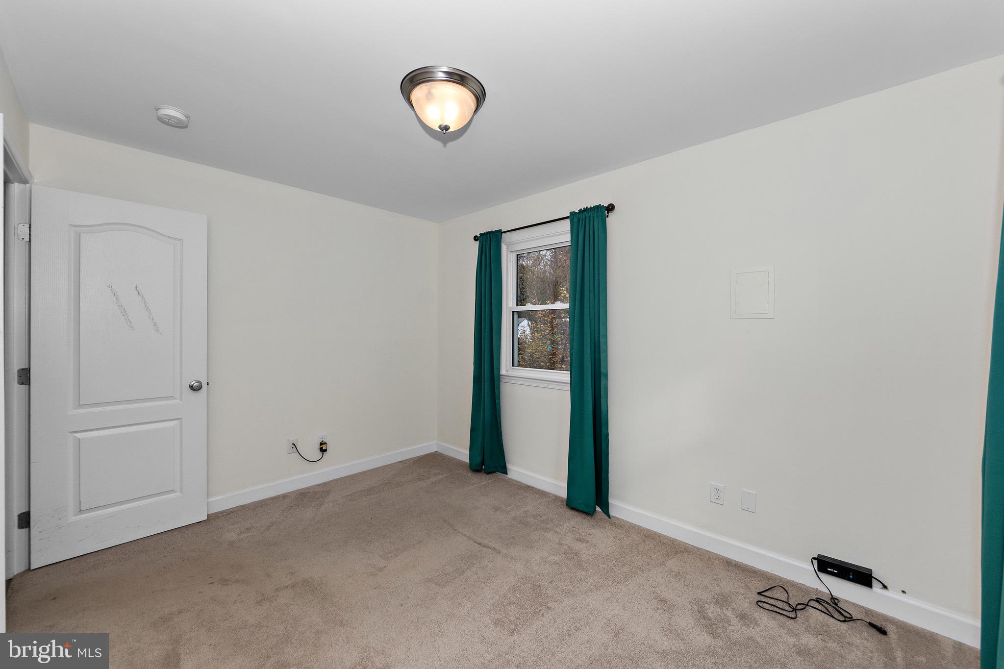 115 Valley View Avenue Edgewater, MD 21037 - Photo 30 of 56 an empty room with a window