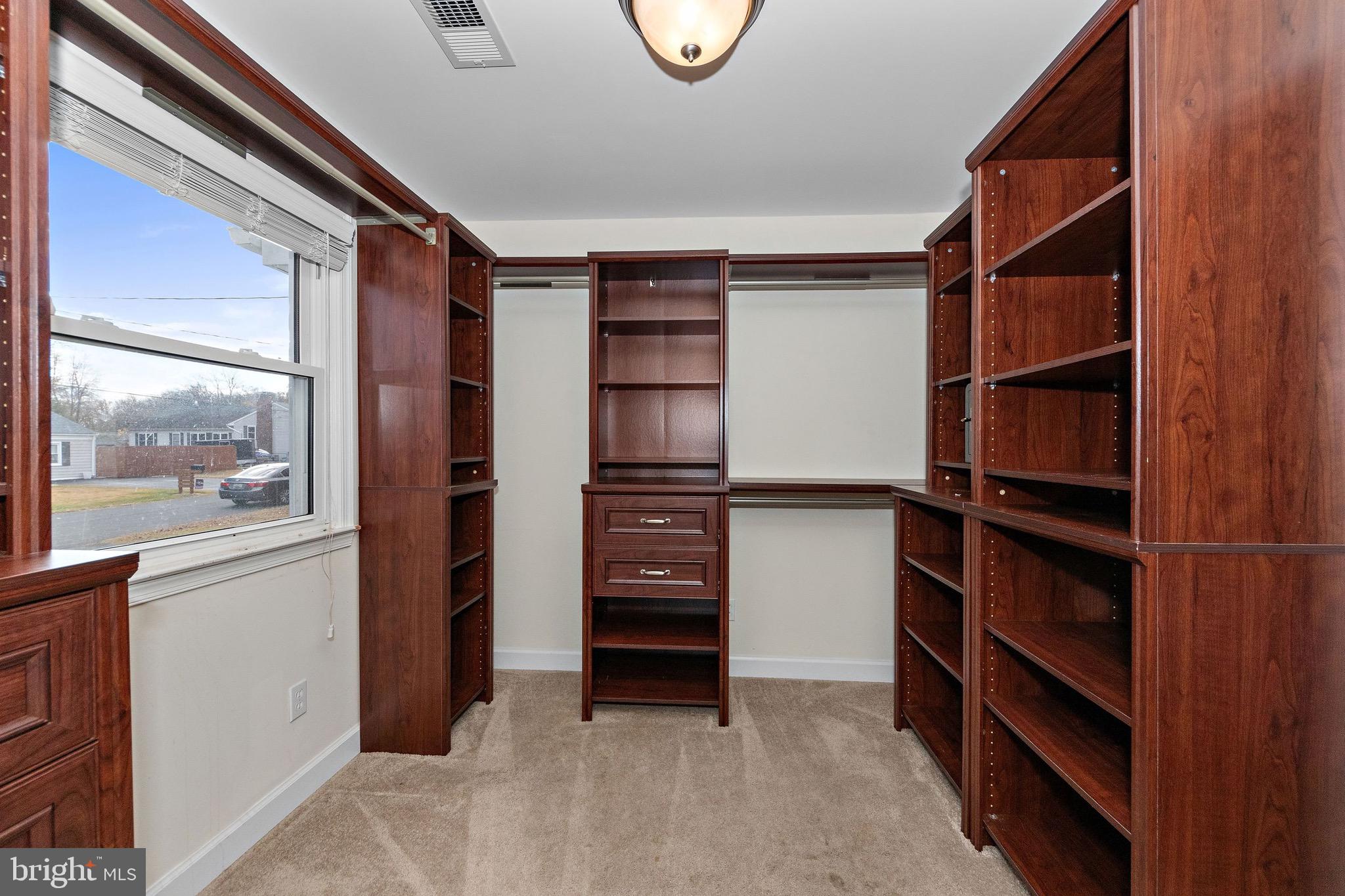 115 Valley View Avenue Edgewater, MD 21037 - Photo 34 of 56 a view of walk in closet with clothes and shoes