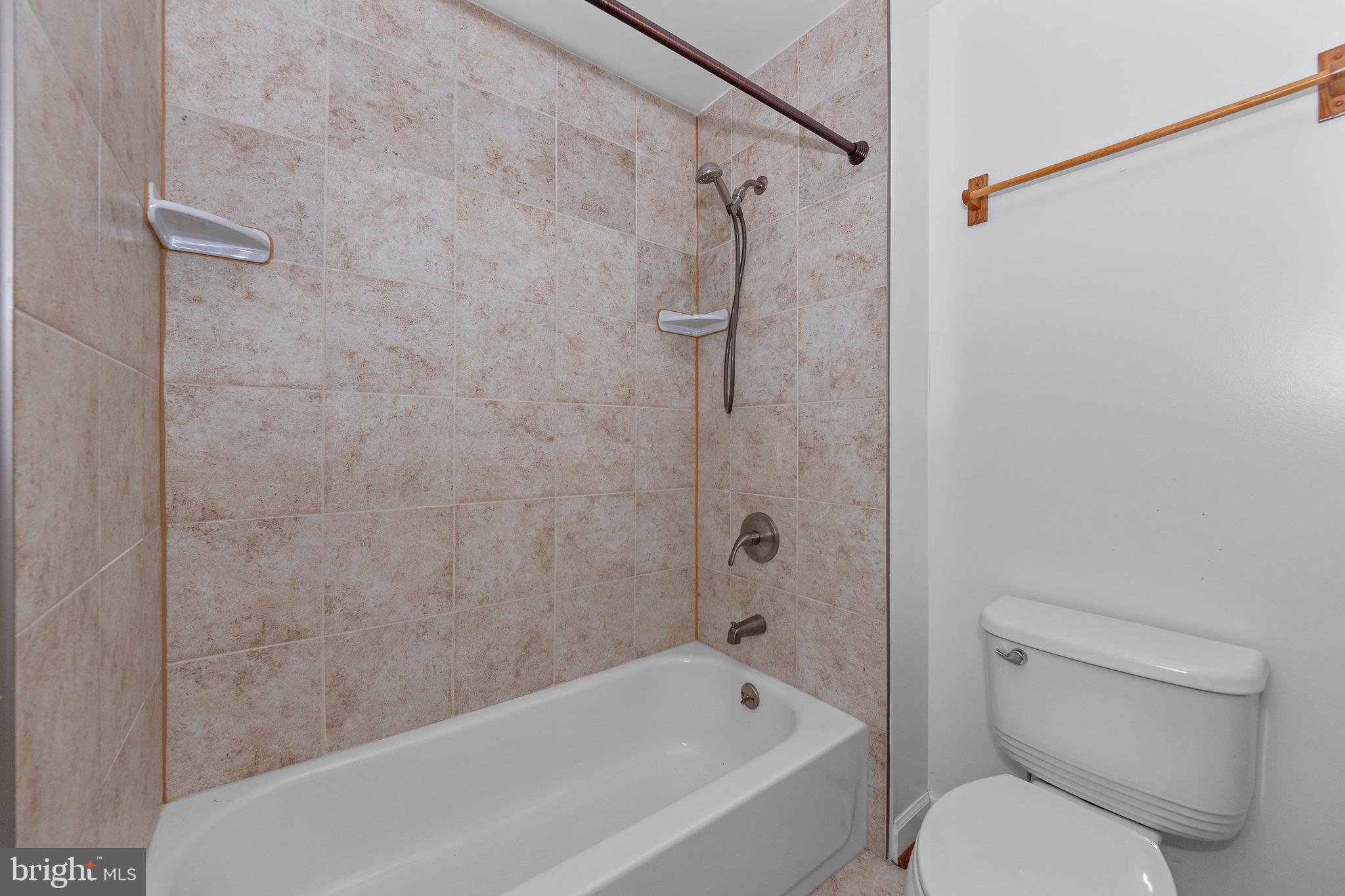 115 Valley View Avenue Edgewater, MD 21037 - Photo 37 of 56 a bathroom with a toilet and a bathtub