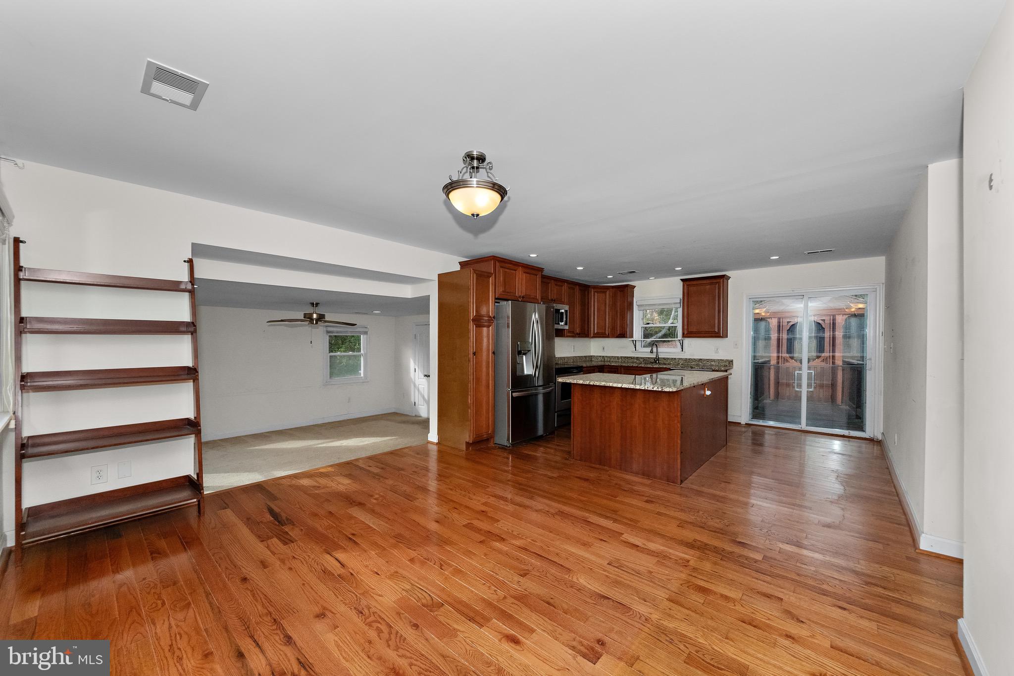 115 Valley View Avenue Edgewater, MD 21037 - Photo 4 of 56 a open kitchen with stainless steel appliances granite countertop a stove cabinets and wooden floor