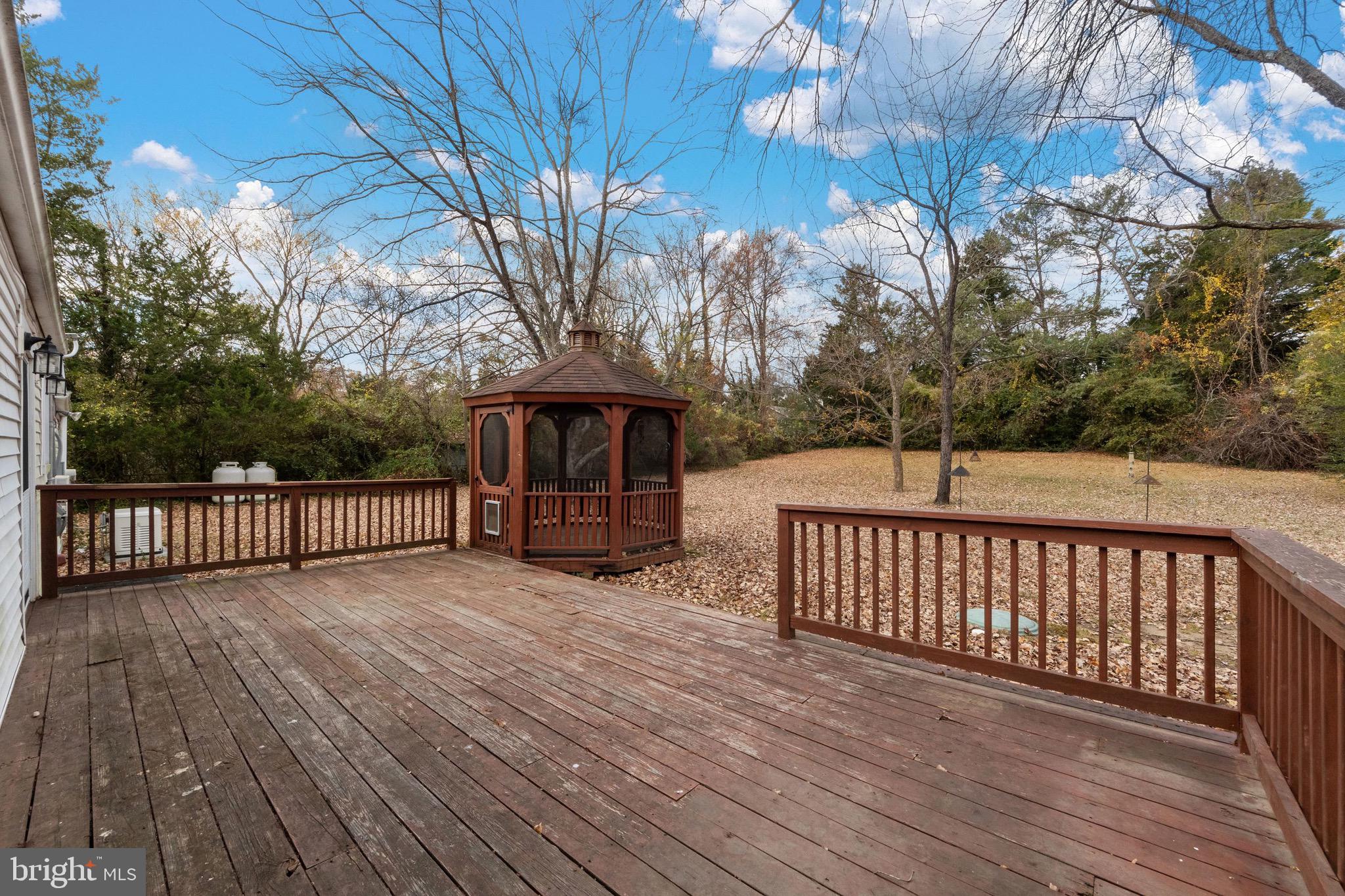 115 Valley View Avenue Edgewater, MD 21037 - Photo 41 of 56 a view of deck with wooden floor and fence with a bench