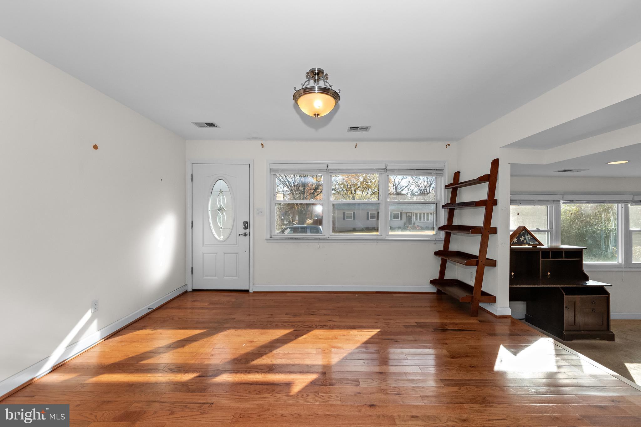 115 Valley View Avenue Edgewater, MD 21037 - Photo 6 of 56 a view of empty room with wooden floor and fan