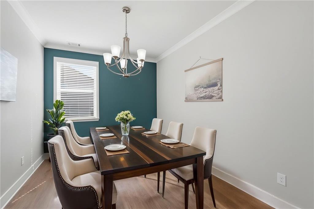 1413 Bluffs Ridge Way Canton, GA 30114 - Photo 14 of 62 a view of a dining room with furniture window and wooden floor