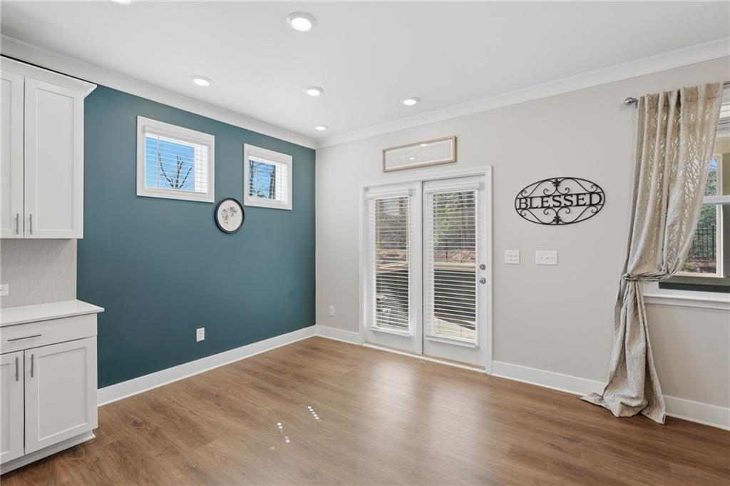 1413 Bluffs Ridge Way Canton, GA 30114 - Photo 15 of 62 a view of livingroom with hardwood floor and window