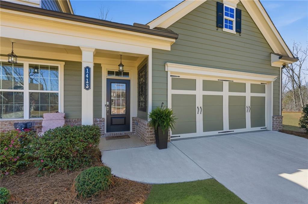 1413 Bluffs Ridge Way Canton, GA 30114 - Photo 2 of 62 front view of a house