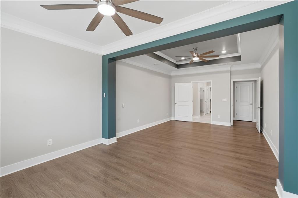 1413 Bluffs Ridge Way Canton, GA 30114 - Photo 22 of 62 a view of empty room with wooden floor