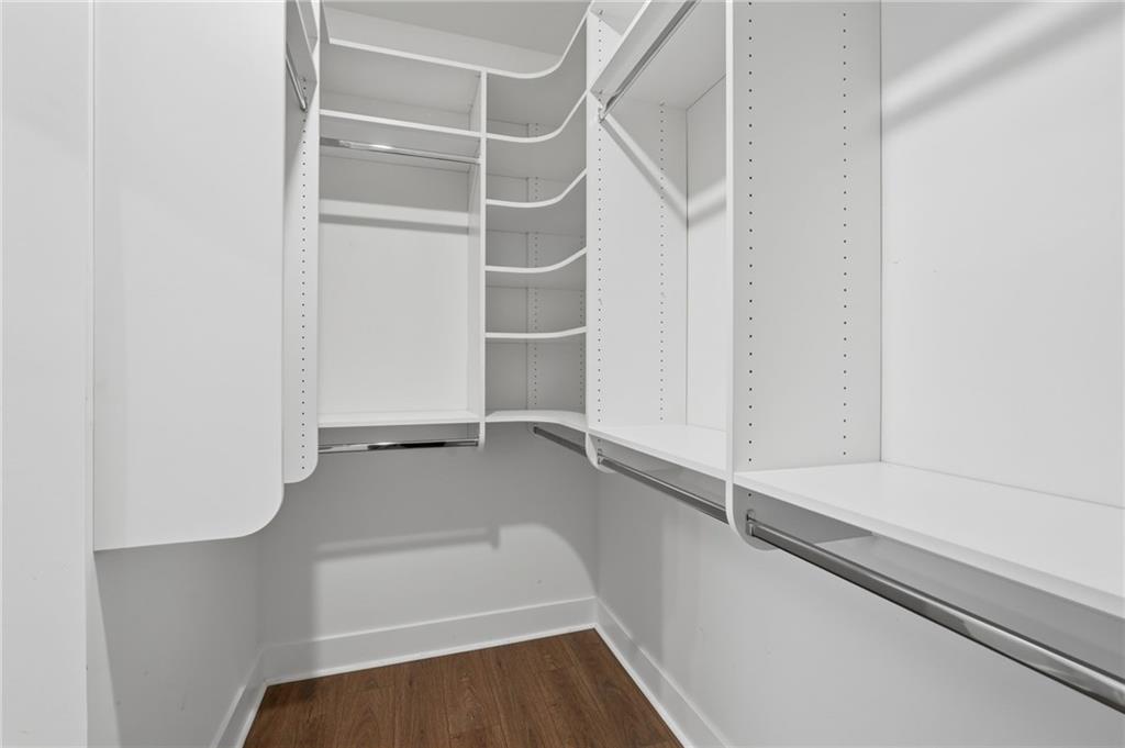 1413 Bluffs Ridge Way Canton, GA 30114 - Photo 26 of 62 a view of walk in closet with empty racks