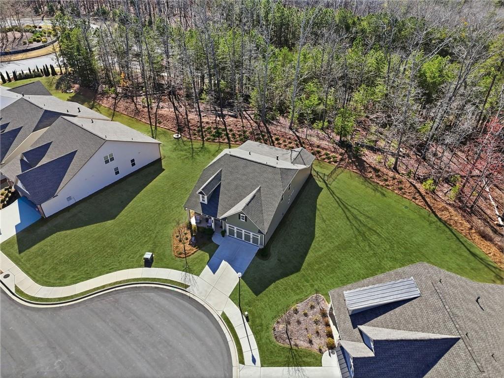 1413 Bluffs Ridge Way Canton, GA 30114 - Photo 3 of 62 an aerial view of a tennis ground and a large tree