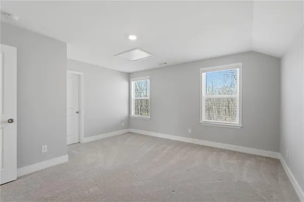 a living room with furniture and windows