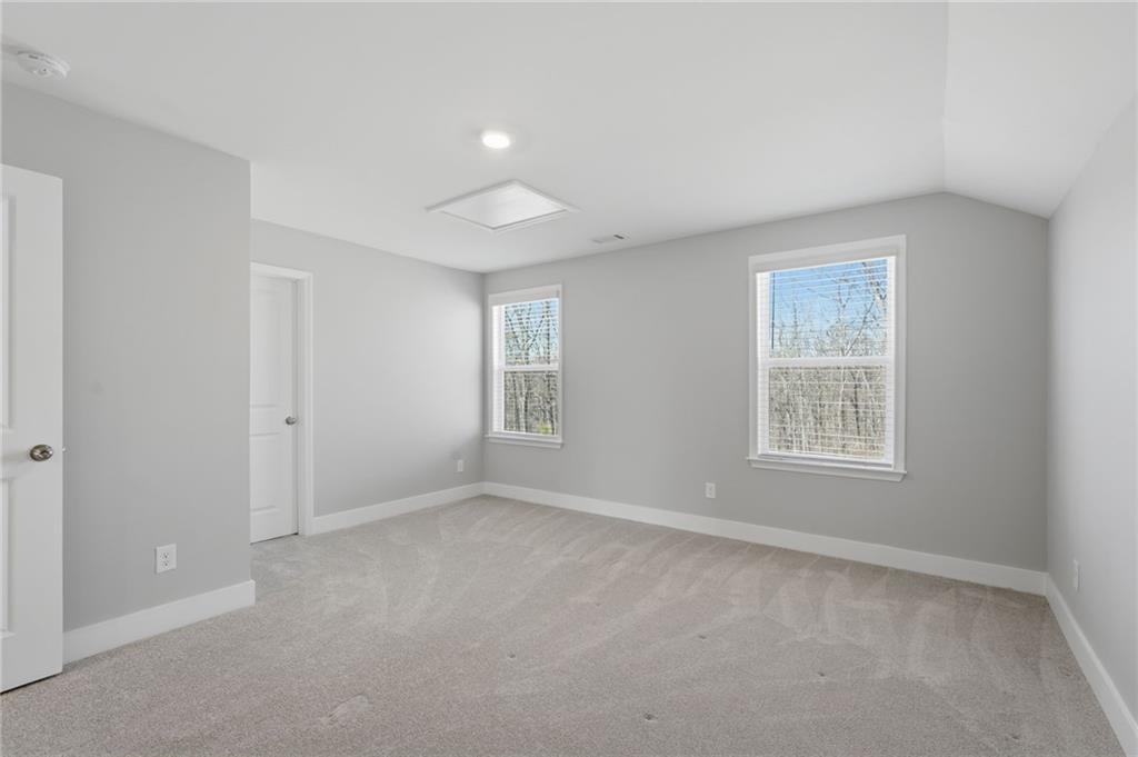 1413 Bluffs Ridge Way Canton, GA 30114 - Photo 34 of 62 a view of an empty room with a window