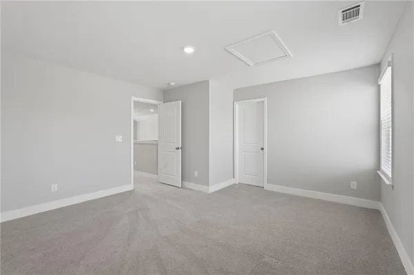 a view of a park with large trees