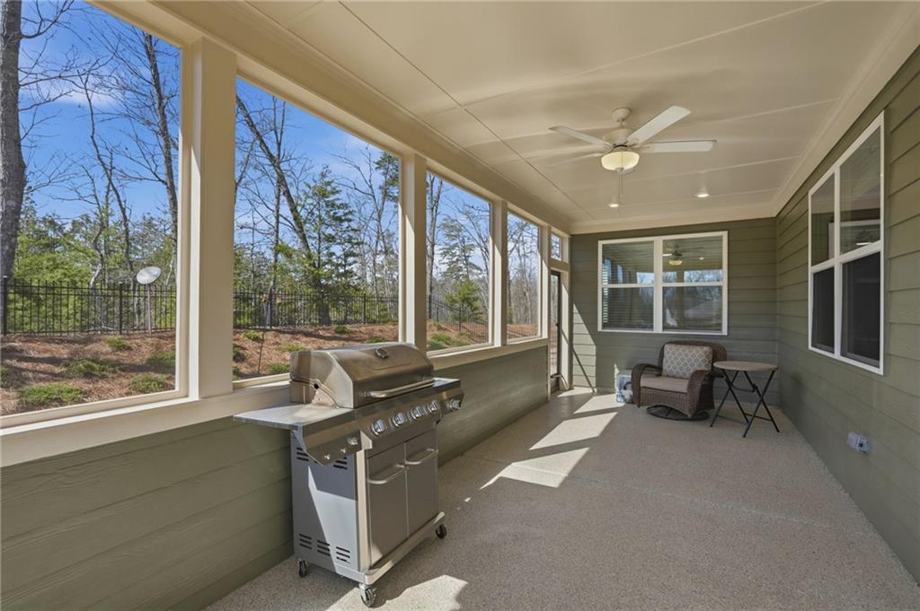 1413 Bluffs Ridge Way Canton, GA 30114 - Photo 38 of 62 a living room with furniture and windows