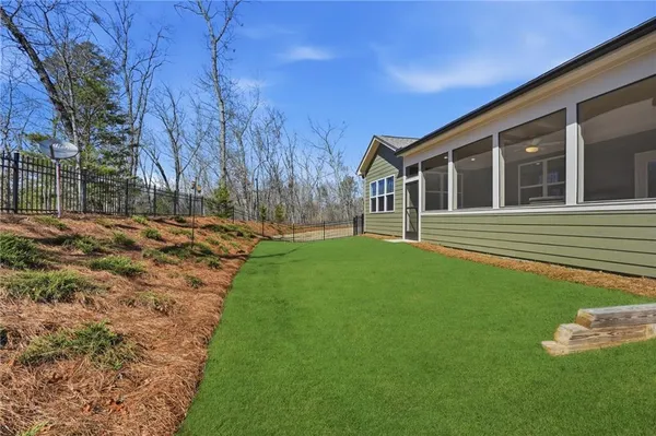 an aerial view of a house with garden space and street view