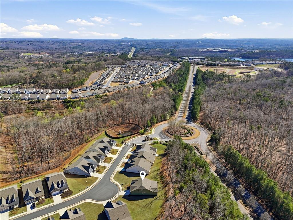 1413 Bluffs Ridge Way Canton, GA 30114 - Photo 44 of 62 an aerial view of a house with a yard and lake view