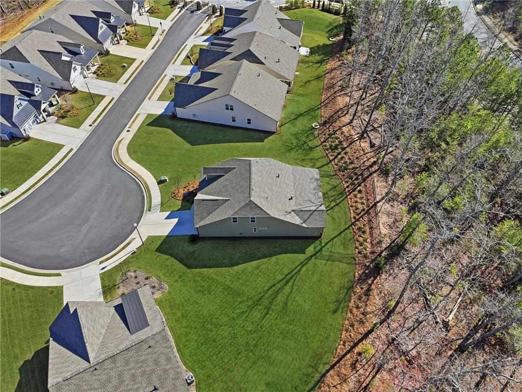 1413 Bluffs Ridge Way Canton, GA 30114 - Photo 45 of 62 an aerial view of a house with garden space and street view