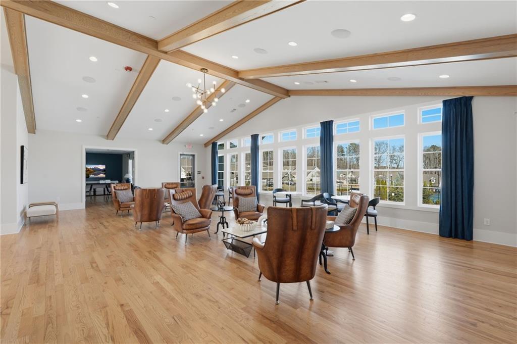 1413 Bluffs Ridge Way Canton, GA 30114 - Photo 49 of 62 a living room with furniture and a large window