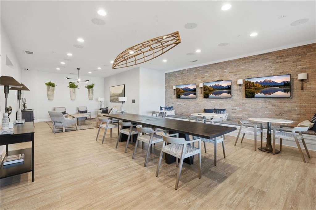 1413 Bluffs Ridge Way Canton, GA 30114 - Photo 52 of 62 a large kitchen with a table and chairs in it